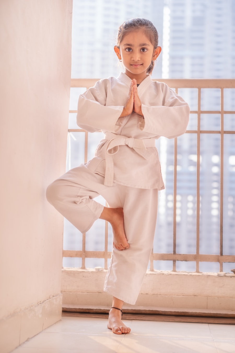 Child practicing yoga pose